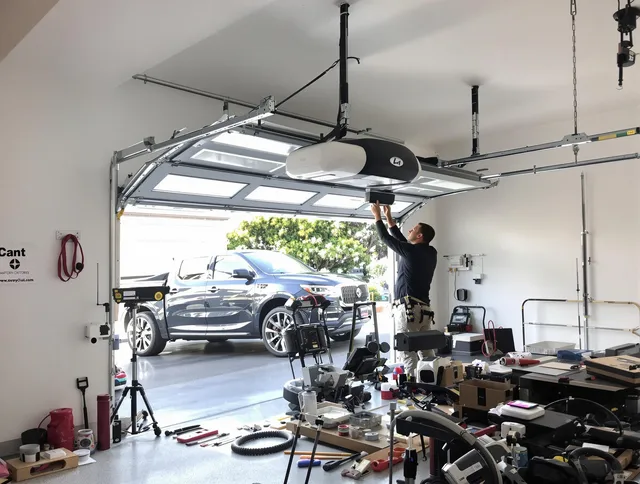 Newington Garage Door Repair specialist installing smart garage door opener system in Newington home