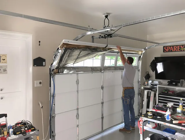 Garage door section replacement by Newington Garage Door Repair in Newington