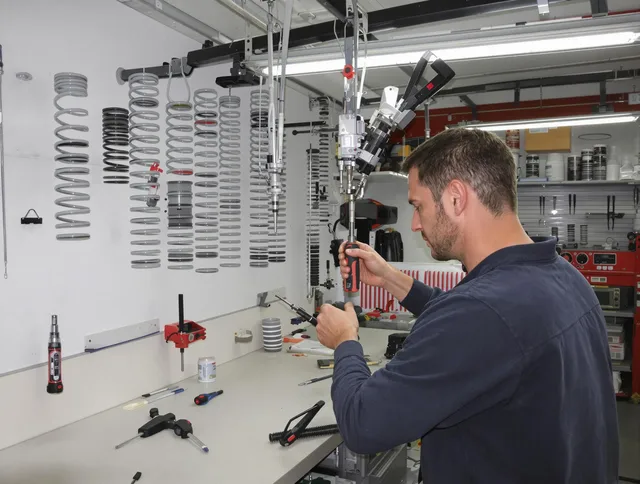 Newington Garage Door Repair safety certified technician performing precision spring replacement in Newington