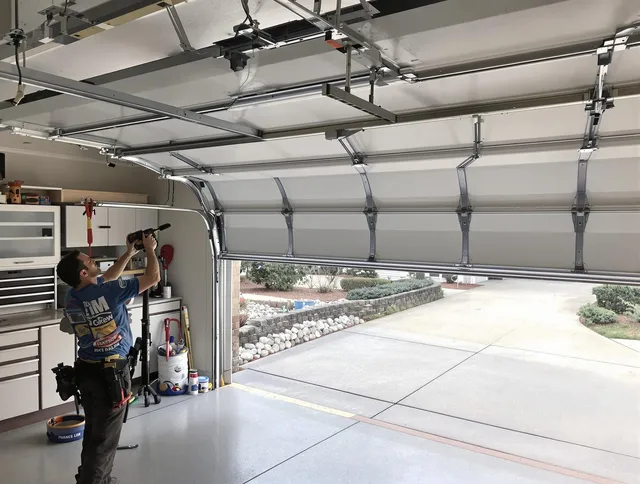 Garage door track repair service by Newington Garage Door Repair in Newington